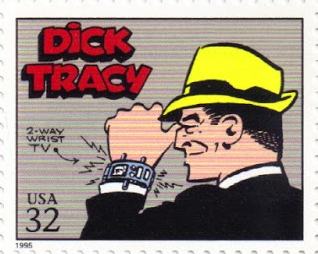 on this U.S. postage stamp, Dick Tracy, wearing a black suit and yellow hat, checks his two-way wrist TV