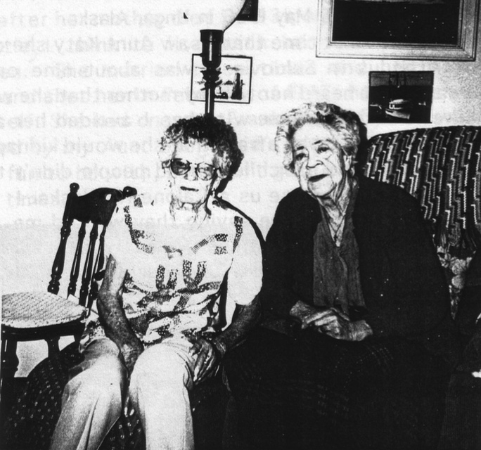 Two elderly women, seated