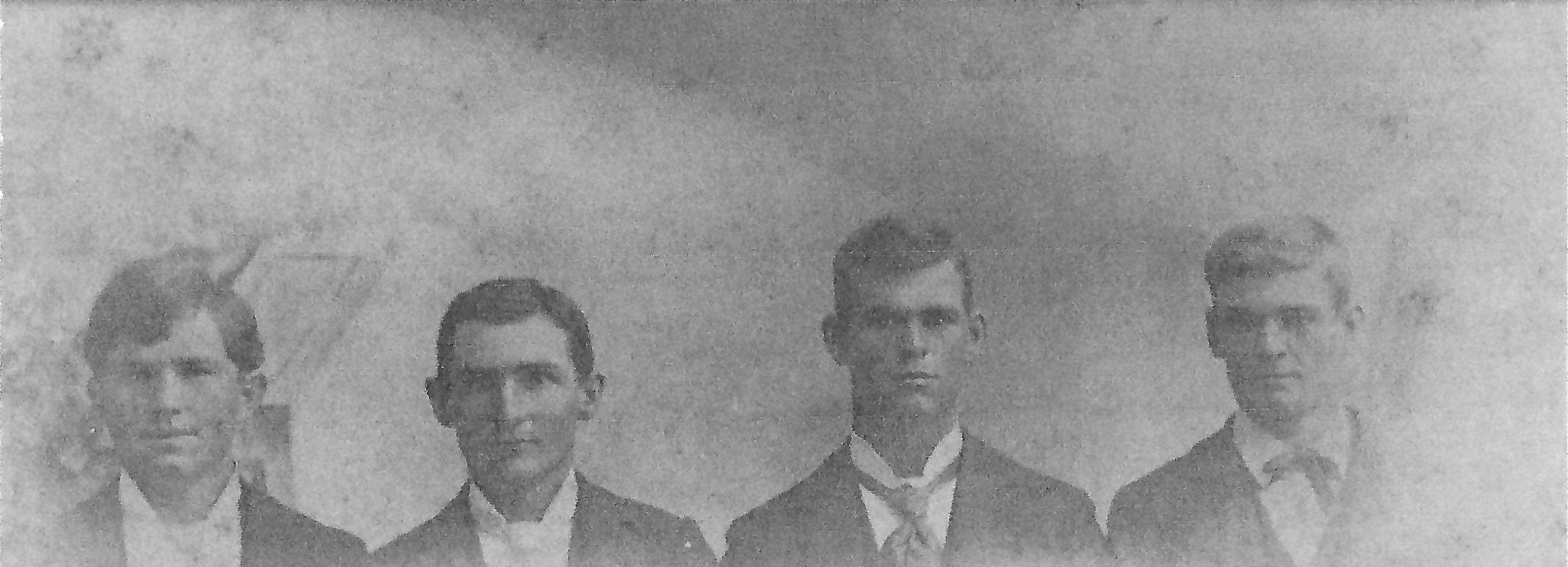 Sharp brothers in formal dress in a row: James, Tom, William, Earl.