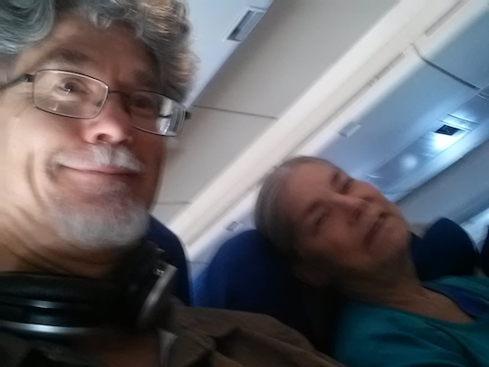 Tom and Liz aboard British Airways flight for London