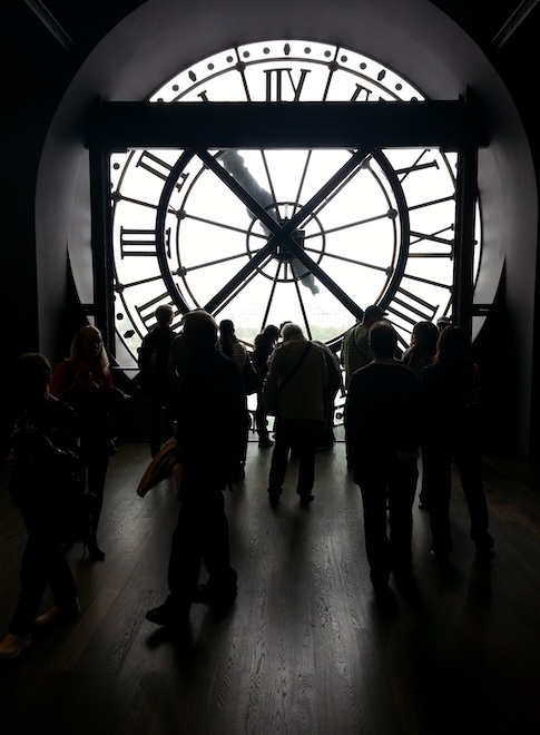 People behind the clockface on the 5th floor of Musee d’Orsay