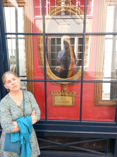 In the window of Cafe Procope, Liz, Alexis Peron, the cafe’s comment, and Tom